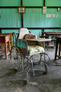 Moses' wheelchair, funded by Liliane Fonds, stays at school. This is the most practical solution. At home Moses practices with his foot splints.